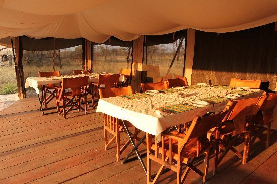 The Serengeti Kati Kati Tented Camp with dining tables and chairs inside
